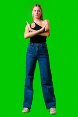 Young Woman Making Stop Sign Gesture on green background