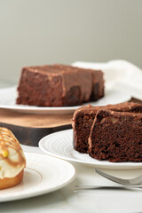 Homemade desserts sponge cake and cinnamon bun on table