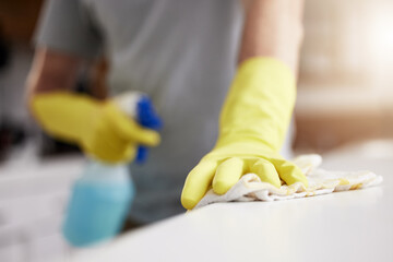 Person, cleaning and cloth in hands with spray, product or janitor with detergent bottle for...