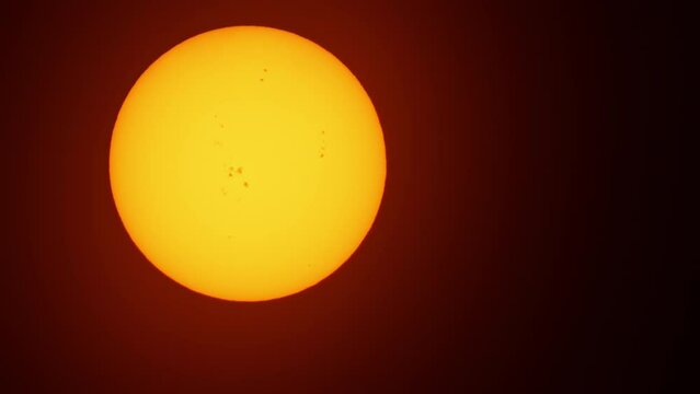 Atmosphere distortion and heat haze on the hot sun disk edges caused by heat waves during hot summer high temperatures time and intense climate change. Heatwave air pollution natural disaster.