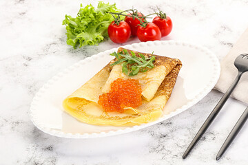 Russian pancake with red caviar