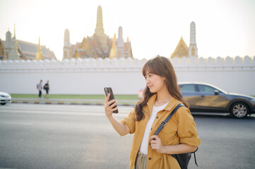 Traveler asian woman in her 30s using smartphone for navigation destination on the urban street at Bangkok, Thailand. - 792478200