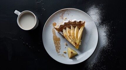 There is a cup of coffee with milk and a slice of apple pie on a white plate against a black