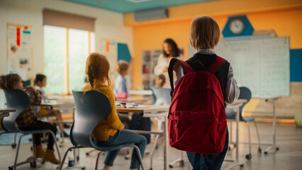 Boy Joining the Class. Elementary School Kid Entering a Mathematics Class with a Red Backpack,...