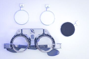Optometric frame measurement. Trial frame for eye test - obrazy, fototapety, plakaty