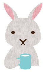 マグカップで飲み物を飲んで休憩するウサギ