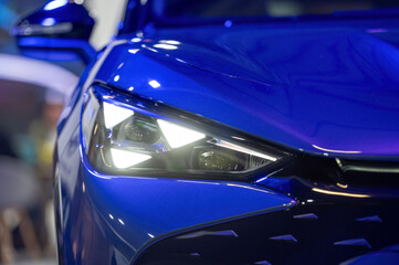 Close-up of the headlights of a modern luxury car. Selective focus.