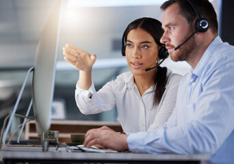 Computer, call center and woman coaching man for support, help or customer service team training at...