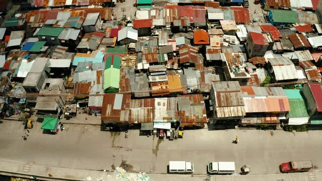 Dense building houses in the slums of Manila top view. Overpopulated poor area.