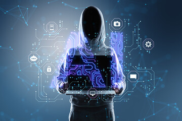Hacker in hoodie holding and showing laptop with glowing blue AI hologram on blurry background. Artificial intelligence, technology and innovation concept.
