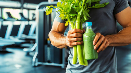 Fit man with green smoothie and celery, promoting healthy lifestyle and proper nutrition during workouts