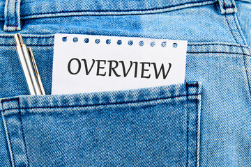 OVERVIEW written on a piece of paper that appeared from the pocket of jeans - obrazy, fototapety, plakaty