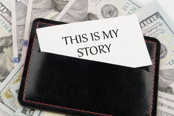 Business and my story concept. Text This is my story on a business card in a leather accessory on...