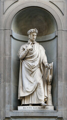 Statue of Dante Alighieri in the niches of the Uffizi Gallery colonnade, Florence, Italy.