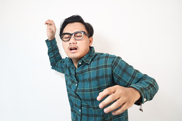 Fototapeta premium Mature Asian man wearing green flannel suffering from lower back pain