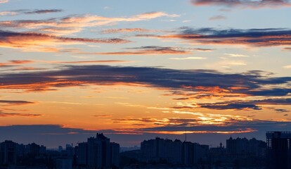 Beautiful fiery sky silhouette city blue hour