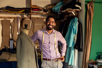 Portrait of male fashion tailor in his workshop.