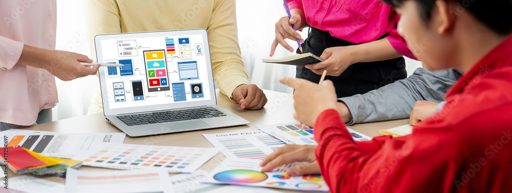Poster cropped image of interior designer team presents color by using color swatches while laptop displaye