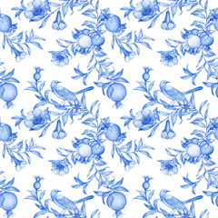 Seamless floral pattern in blue tones. Pattern with a bird and branches of pomegranates.