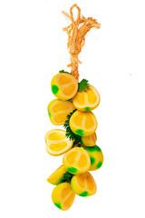 Souvenirs from Sicily. A decorative lemon braid made from the finest Sicilian ceramics, isolated on white. Others include oranges, pomegranates and peppers. - obrazy, fototapety, plakaty