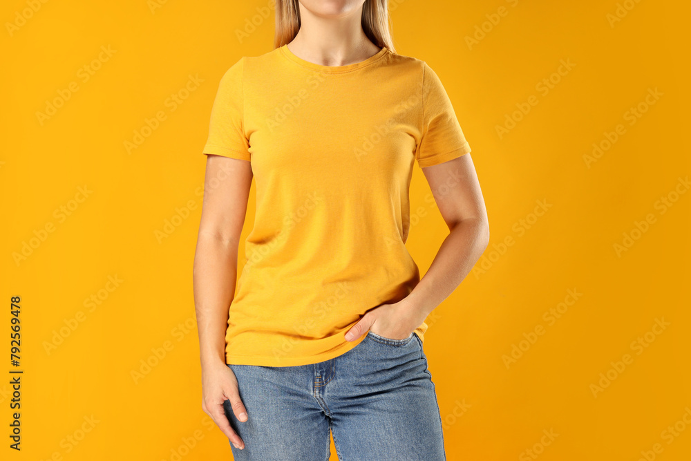 Wall mural A young woman in a yellow T-shirt - Wall murals