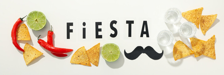 The inscription Fiesta with decorations on a white background