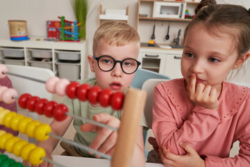 Preschool children using abacus to learn