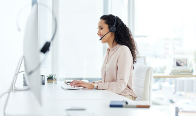 Call center, computer and happy consultant woman in telemarketing office for online assistance or help. Contact us, desk and microphone with sales agent or operator in workplace for customer support