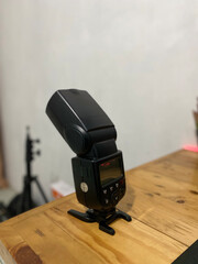 Camera flash equipment is displayed on the table