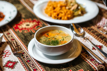 Close-Up of Steaming Bowl of Soup on Wooden Table