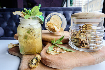 Wooden Board With Jars Filled With Food