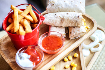Tray of Food With Pita Bread, French Fries, and Ketchup