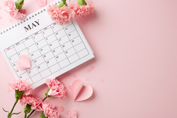 Calendar marked for Mother's Day with pink carnation flowers and heart decorations, signifying the importance of the date - obrazy, fototapety, plakaty