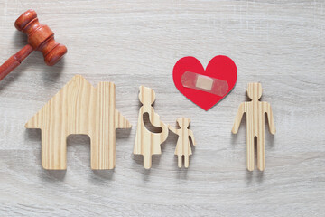 Divorce lawyer Or Attorney, Husband and wife splitting children on wooden background,Joint child...