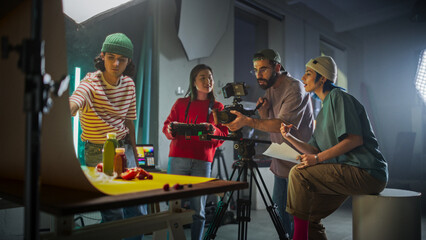 Diverse Young Filmmakers Collaborate On A Vibrant Set, Focusing On A Camera Setup While Discussing...