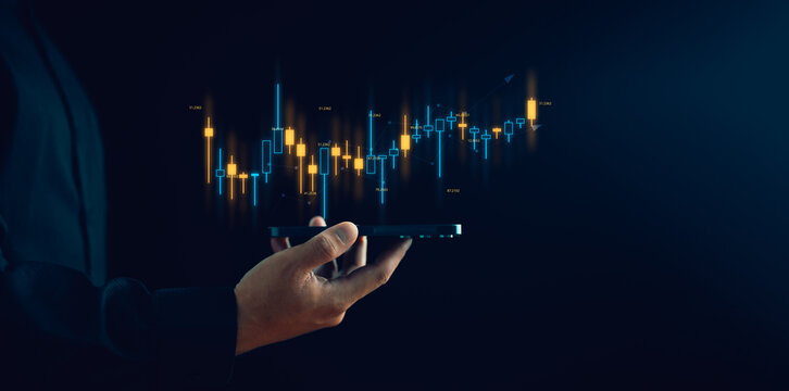 Businessman or trader is showing a growing virtual hologram stock, Planning and strategy, Stock market, Business growth, progress or success concept, invest in trading.