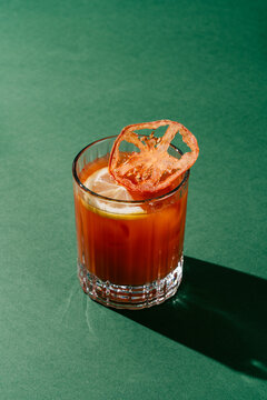 Classic Bloody Mary Cocktail on Green Background