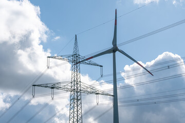 High voltage pole and turbine of a wind power plant. Ecological energy production.
