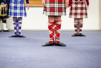 Highland dancers with beautiful costumes at the dance club. - 792617071