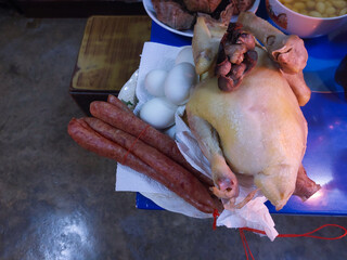 Chicken, eggs, and Chinese sausage for gods worshiping Chinese in the China New Year.