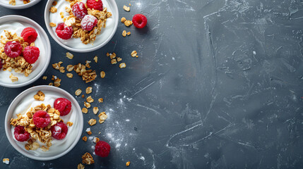 Granola with yogurt in bowls raspberries served 