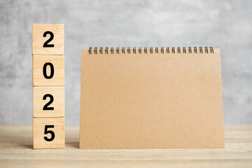 2025 Happy New Year with blank notebook and wooden number. countdown, Resolution, Goals, Plan,...