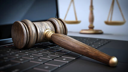 Judge gavel and balanced scale standing on laptop computer keyboard. 3D illustration - 792627498
