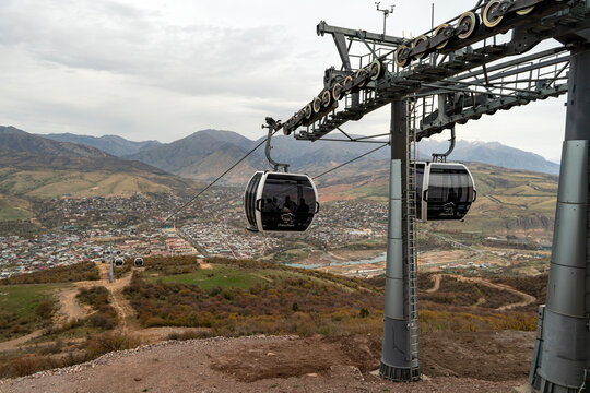 Tashkent region, Uzbekistan. Chinorkent cable car in Khodjikent mountains with view of Charvak reservoir