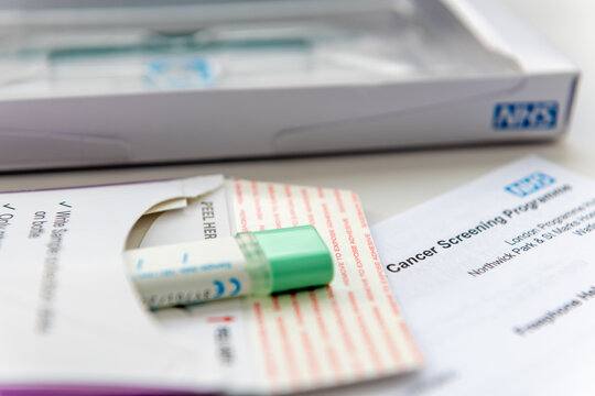London. UK- 04.17.2024. A sample holder with a sealed bowel cancer test sample ready to go into the return envelope to be sent off for testing.