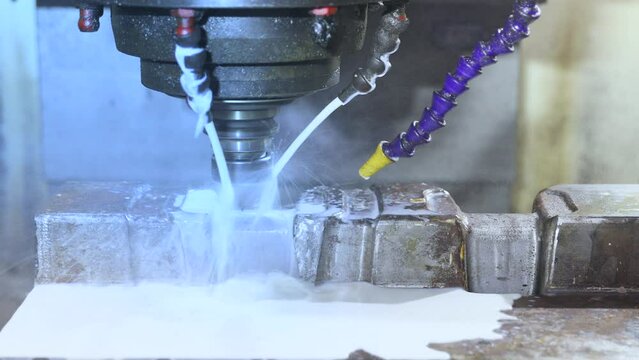 cnc grinding milling machine. cnc turning center. cnc machining high precision turning throwing coolant liquid on metal component during shaping forming process using machining center	
