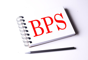 BPS word on notebook on white background