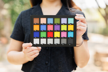 Photography model holding color checker board or colors chart for calibrate accurate colors photos or videos - 792644845