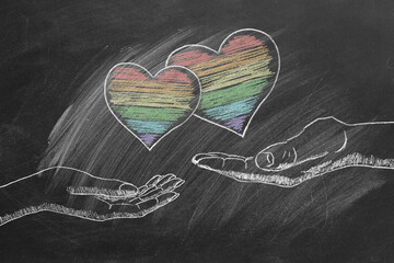 Male and female palms with rainbow hearts. LGBT, LGBTQIA rights and gender equality concept. Pride month. Declaration of love, acceptance of feelings, giving love.