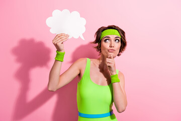 Photo of serious lady coach hold mind cloud decide what sport club choose isolated pastel color...